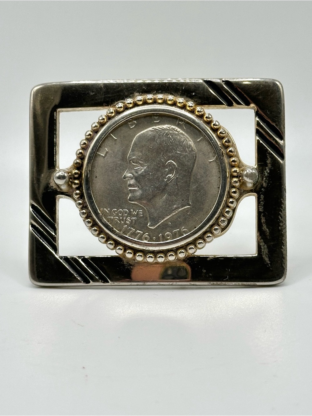 Vintage Eisenhower silver dollar belt buckle.